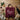Schürze Team Sangiovese gefaltet auf einem Holztisch mit Rotwein und Weingläsern, Geschenkidee - Vinclick #Vitigno_Sangiovese