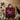 Grembiule Team Nebbiolo piegato su tavolo in legno con vino rosso e calici, idea regalo - Vinclick #Vitigno_Nebbiolo
